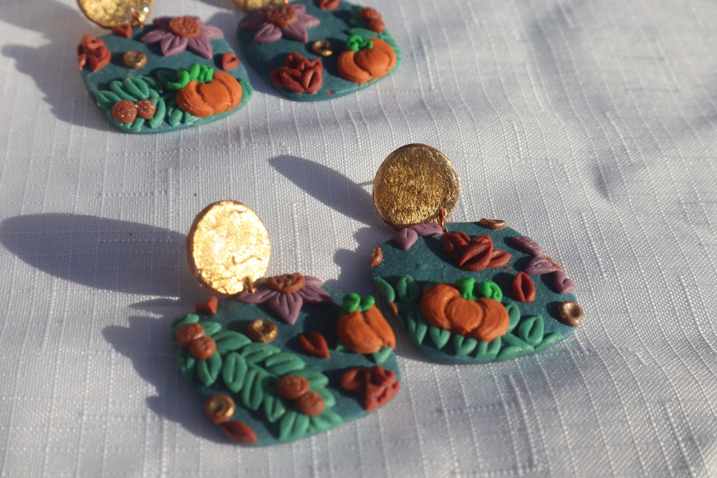 Halloween inspired pumpkin patch dangles,polymer clay lightweight with resin, handmade beautiful earrings, Nickel free findings. Seconds