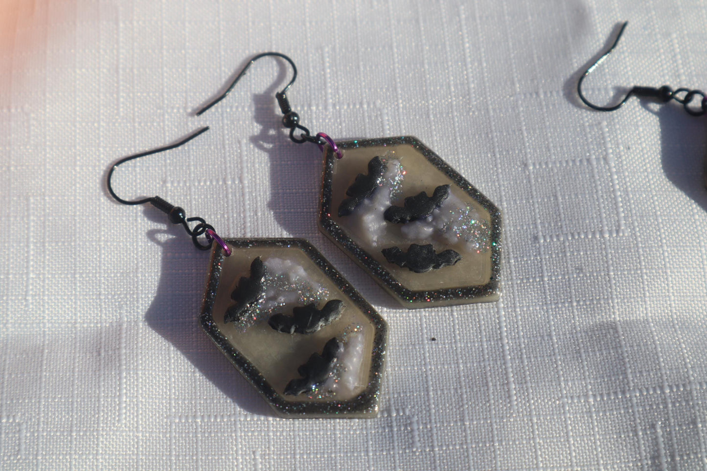Halloween inspired dangles,polymer clay lightweight with resin, handmade beautiful earrings, Nickel free findings. Bats and floral pumpkins