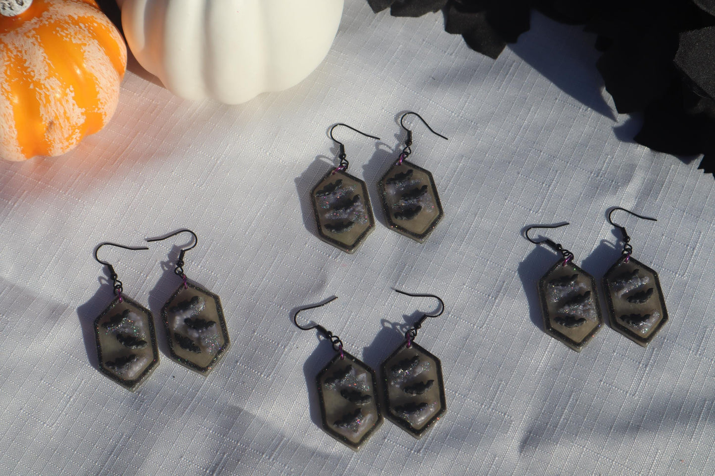 Halloween inspired dangles,polymer clay lightweight with resin, handmade beautiful earrings, Nickel free findings. Bats and floral pumpkins