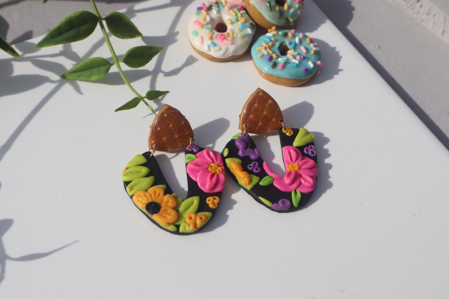 VC pick ‘a’ mix arch dangles. Mixed media. Have small flaws. All are discounted and have nickel free findings and resin backs ‘Summer days’