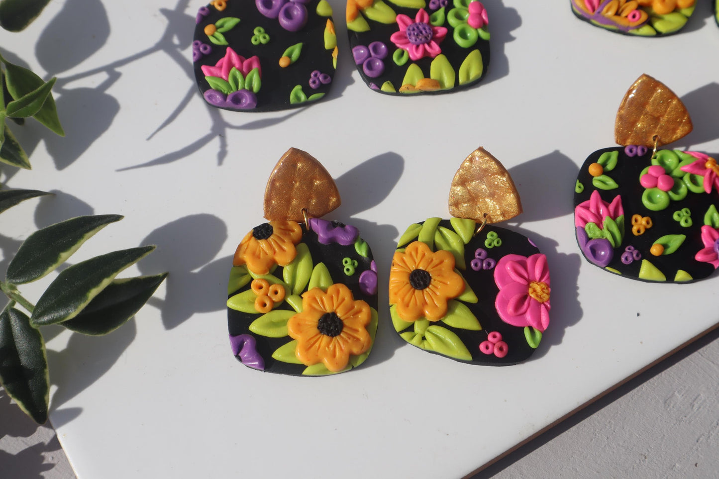 VC pick ‘a’ mix square dangles Mixed media. Have small flaws. All are discounted and have nickel free findings and resin backs ‘Summer days’