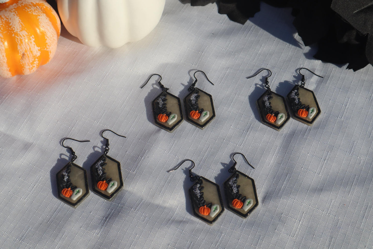 Halloween inspired dangles,polymer clay lightweight with resin, handmade beautiful earrings, Nickel free findings. Bats and floral pumpkins