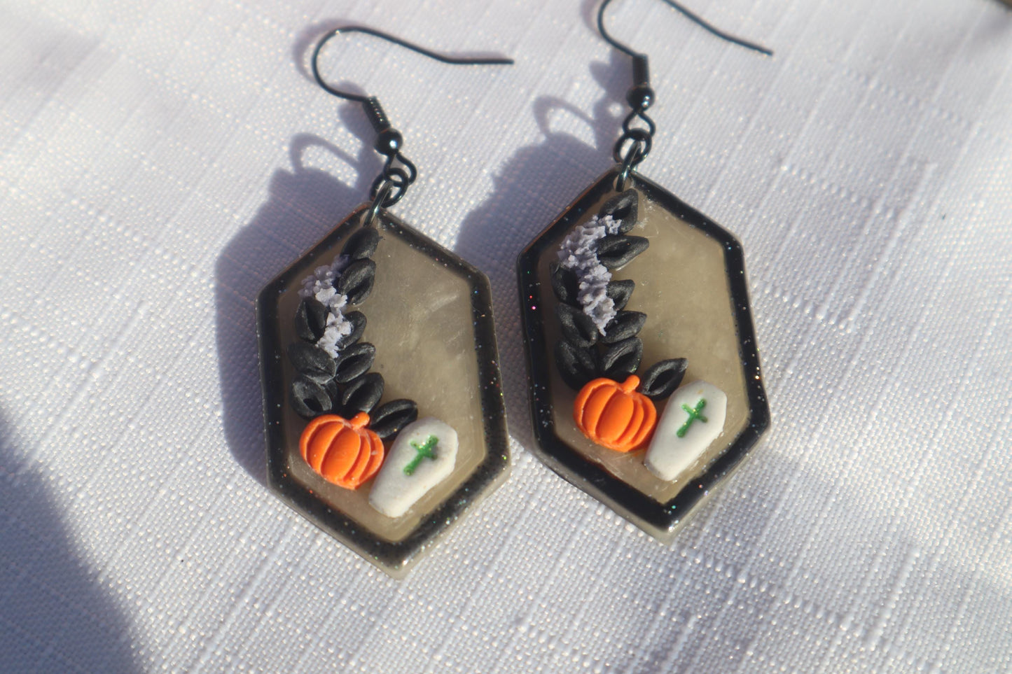 Halloween inspired dangles,polymer clay lightweight with resin, handmade beautiful earrings, Nickel free findings. Bats and floral pumpkins