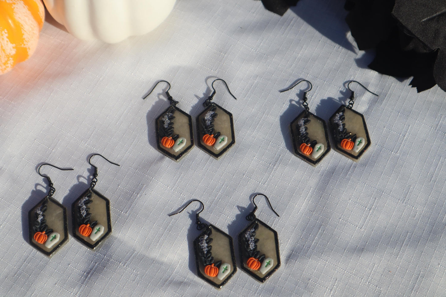 Halloween inspired dangles,polymer clay lightweight with resin, handmade beautiful earrings, Nickel free findings. Bats and floral pumpkins