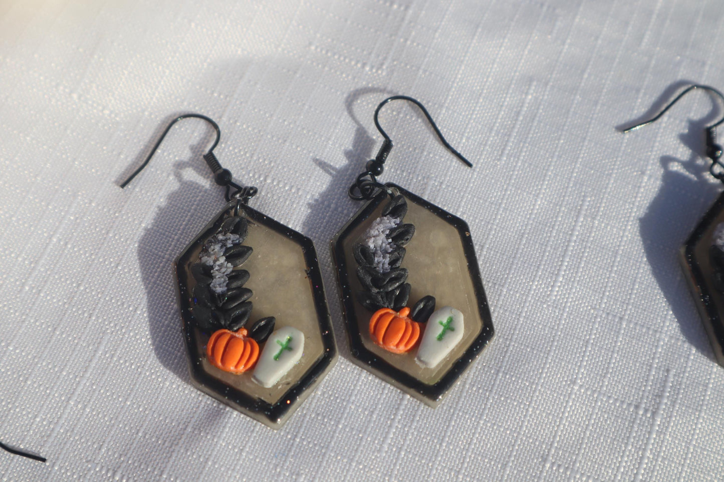 Halloween inspired dangles,polymer clay lightweight with resin, handmade beautiful earrings, Nickel free findings. Bats and floral pumpkins