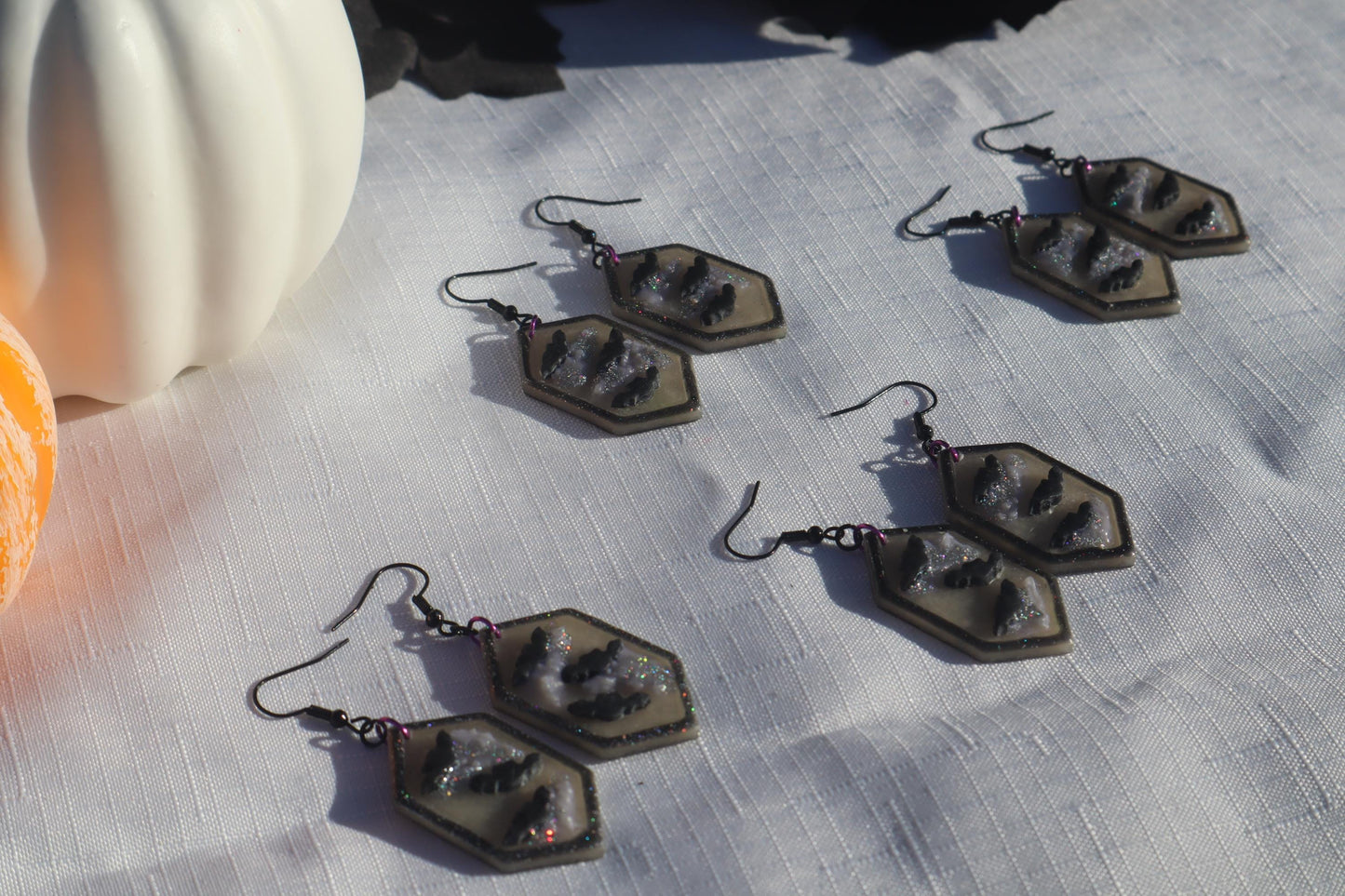 Halloween inspired dangles,polymer clay lightweight with resin, handmade beautiful earrings, Nickel free findings. Bats and floral pumpkins