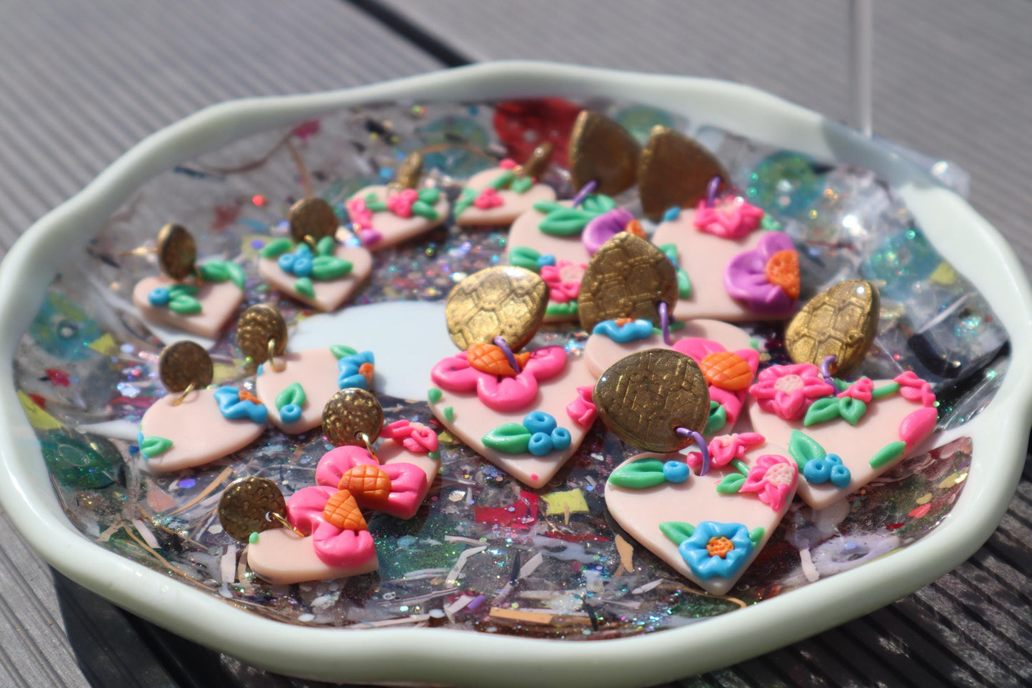 VC pick ‘a’ mix dangles. Mixed media. Have small flaws. All are discounted and have nickel free findings and resin backs