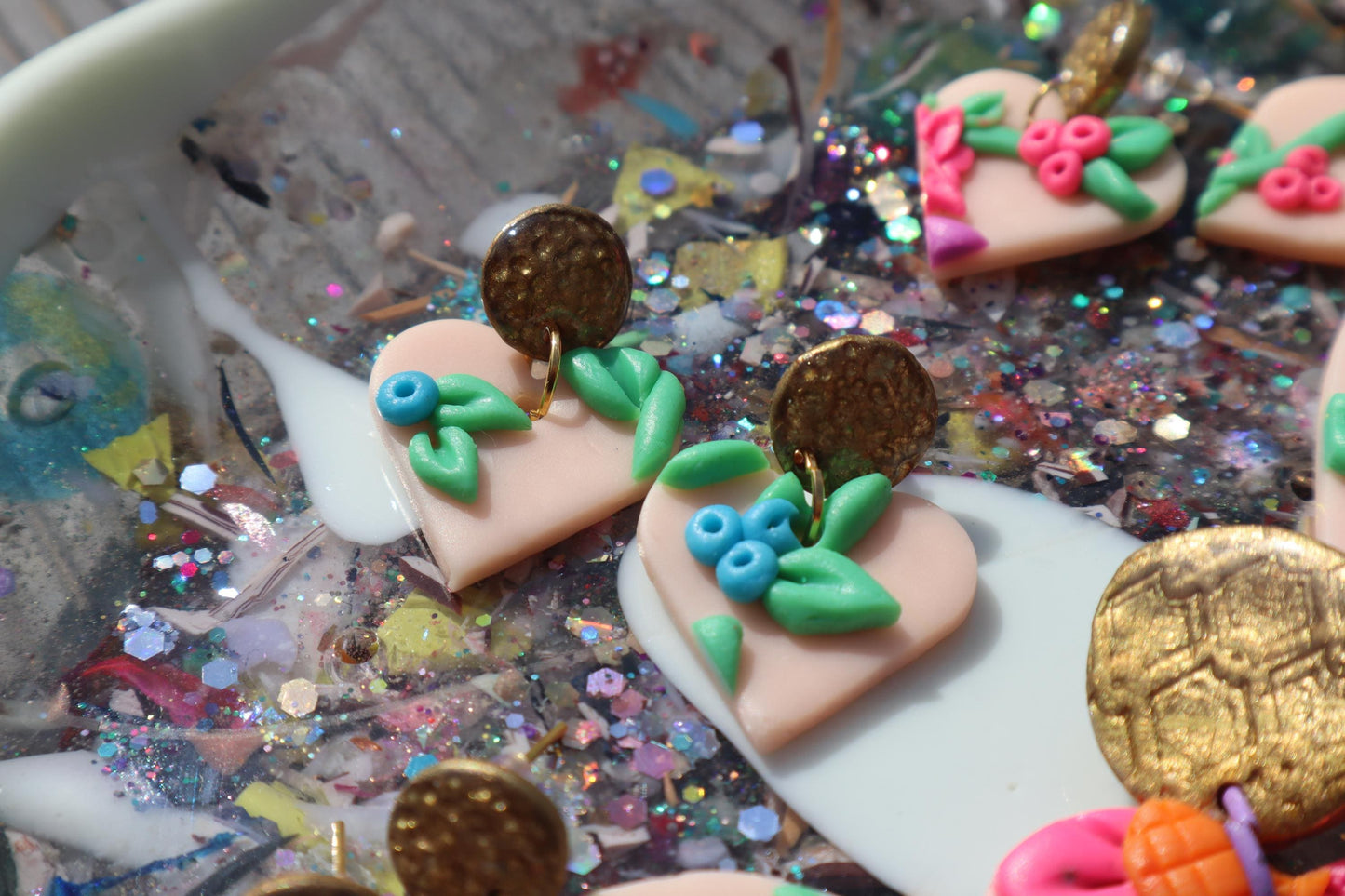 VC pick ‘a’ mix dangles. Mixed media. Have small flaws. All are discounted and have nickel free findings and resin backs